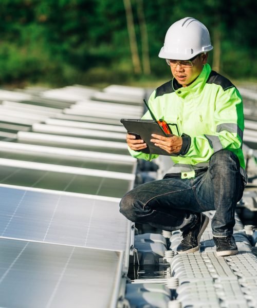 asian-engineer-with-digital-tablet-his-hand-who-plans-expand-plant-with-solar-panels-min-scaled.jpg