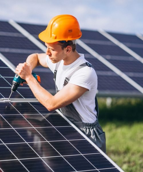 man-worker-firld-by-solar-panels-min-scaled.jpg